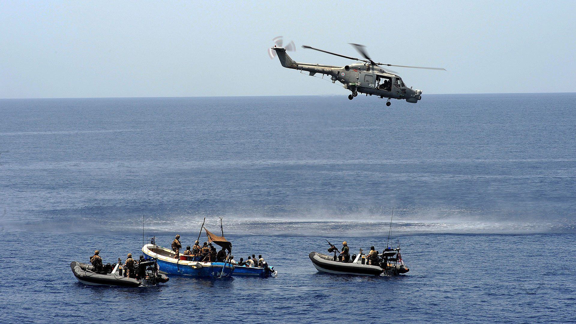 Royal Navy troops intercept two suspicious skiffs during anti-piracy operation in the Gulf of Aden near Somalia. A UMD study shows that rising ocean temperatures and falling fish populations in the area causes more crime at sea.