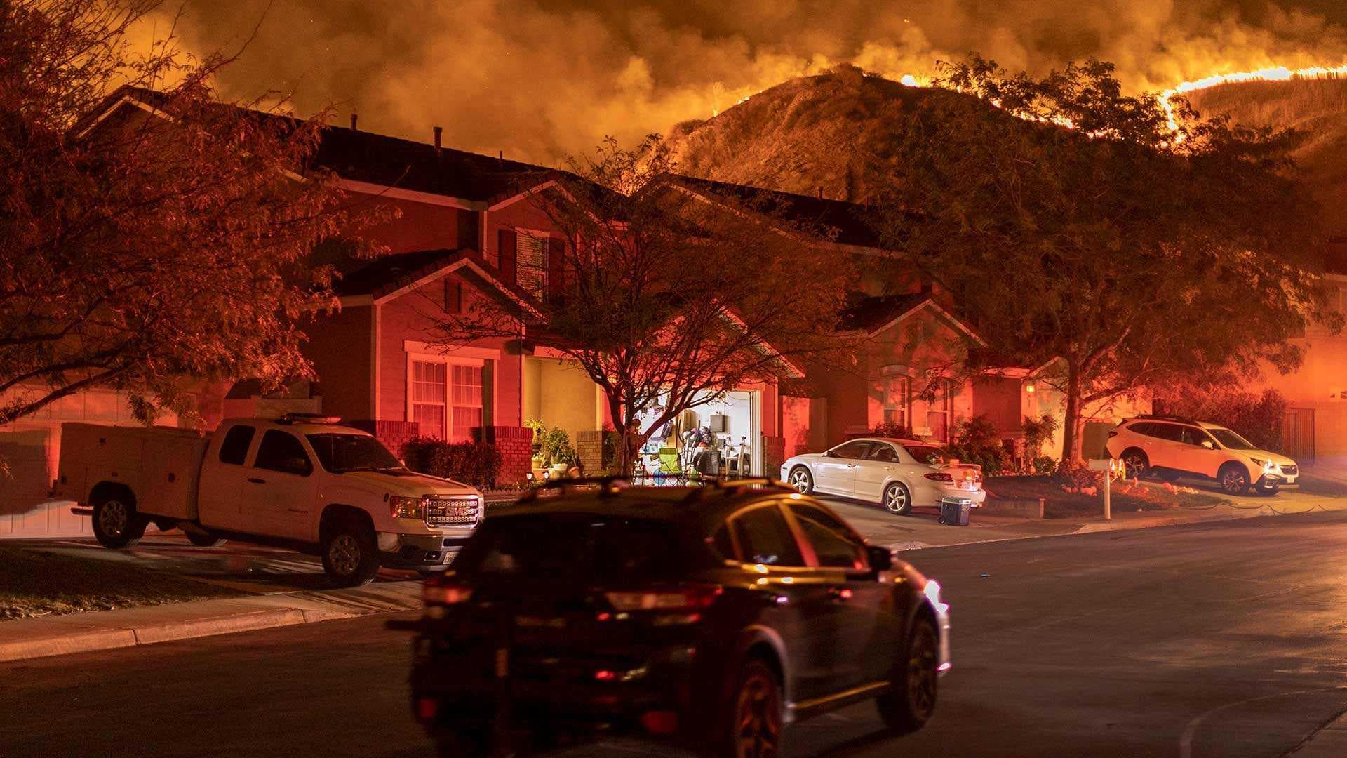 Flames menace a Chino, Calif., neighborhood during the Blue Ridge Fire in October 2020. A new NIH grant will fund a groundbreaking UMD study of the effect of wildfires on infant health in the United States.