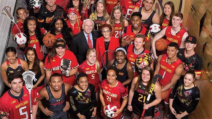 Student athletes from a number of sports pose with their gear in Maryland game day attire
