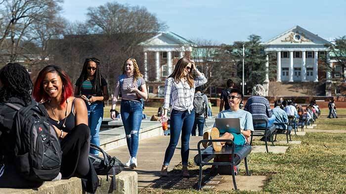 Students mingle, relax, and study outside on McKeldin Mall next to ODK Fountain