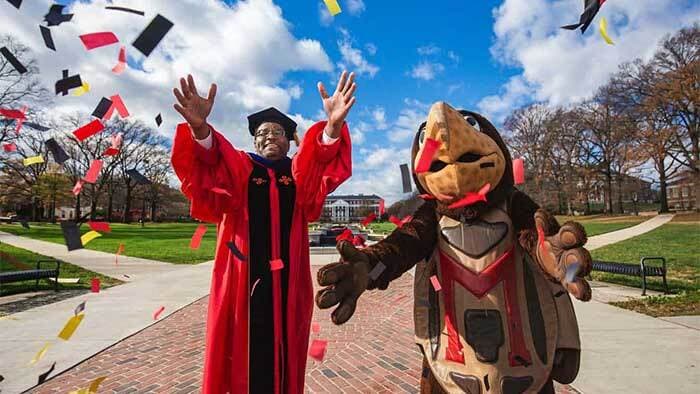president pines celebrating commencement with testudo by throwing some confetti